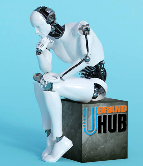 A white android or robot sitting on a slate-colored box with the uBrand Hub logo on the facing side. The robot is reminiscent of the 'Karditsa Thinker,' with its left hand on its left knee and its right elbow resting on its right knee, its right hand under its chin.