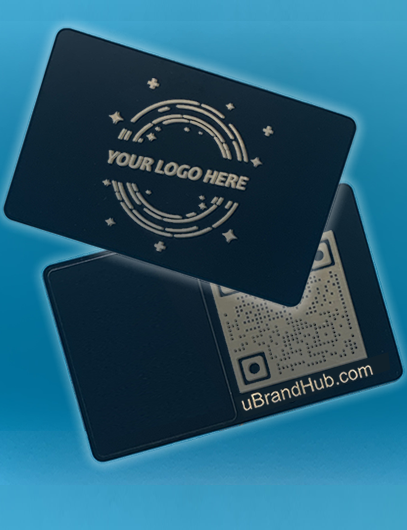Front and back view of a black metal NFC card on a blue background. The front shows a custom logo design, and the back displays a laser-engraved QR code, both with a gold undertone.